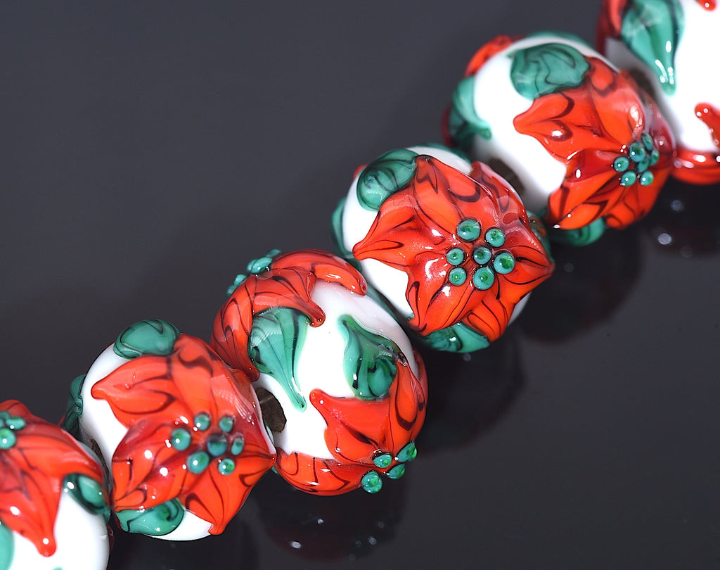 10707801 - Seven Red Poinsettia Christmas Rondelle Beads