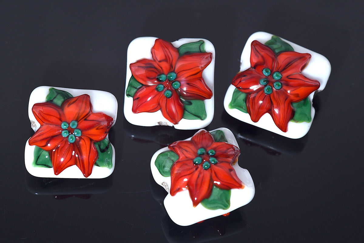 10707814 - Four Red Poinsettia Christmas Pillow Beads