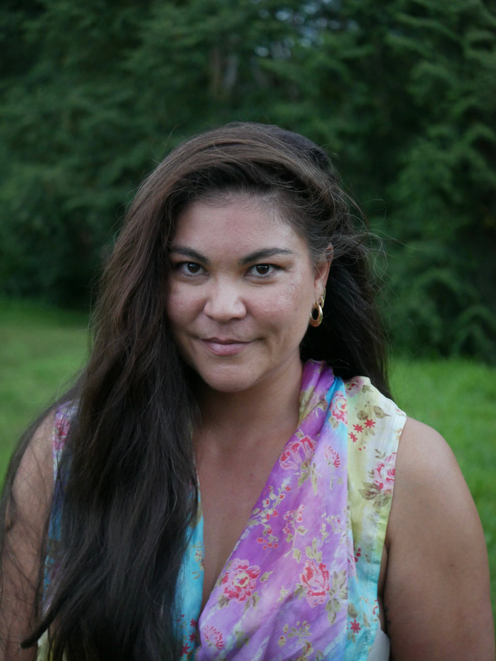 Model in a multicolored purple, blue, yellow, and gray silk scarf, photographed at Olson Keolanui Farms in Hilo.